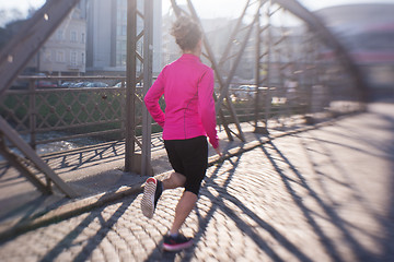 Image showing sporty woman jogging on morning