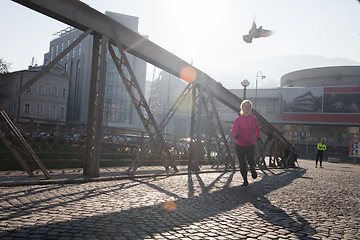 Image showing sporty woman jogging on morning