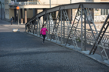 Image showing sporty woman jogging on morning