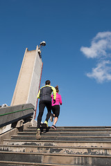 Image showing young  couple jogging on steps