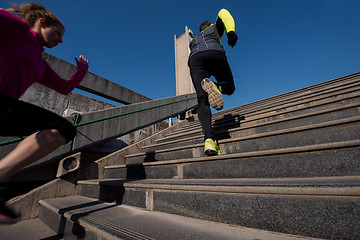 Image showing young  couple jogging on steps