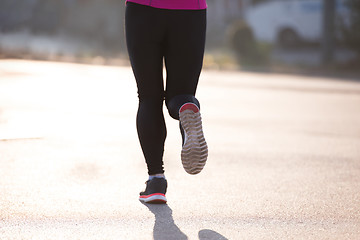 Image showing sporty woman jogging on morning