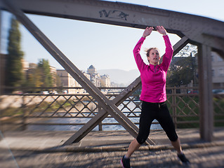 Image showing woman  stretching before morning jogging