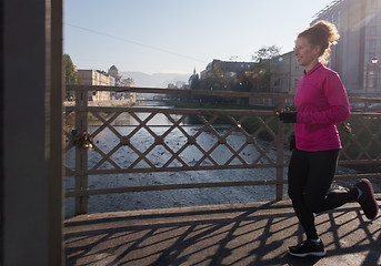 Image showing sporty woman jogging on morning