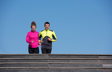 Image showing young  couple jogging on steps