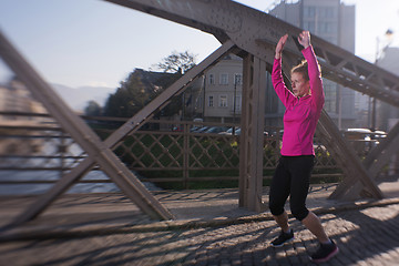 Image showing woman  stretching before morning jogging