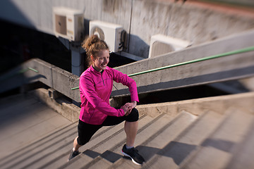 Image showing woman  stretching before morning jogging