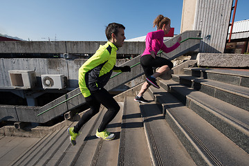 Image showing young  couple jogging on steps