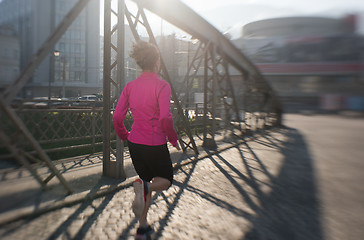 Image showing sporty woman jogging on morning