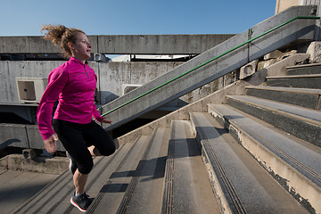 Image showing woman jogging on  steps