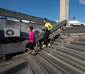 Image showing young  couple jogging on steps