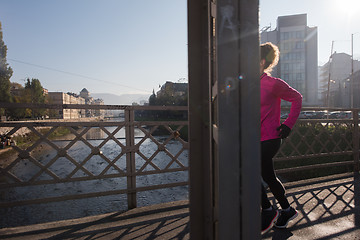 Image showing sporty woman jogging on morning