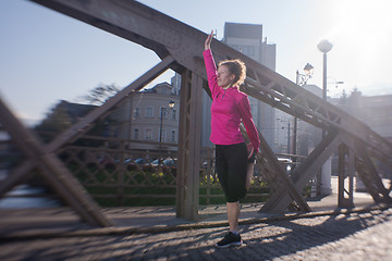 Image showing woman  stretching before morning jogging