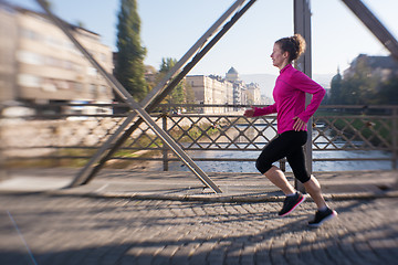 Image showing sporty woman jogging on morning