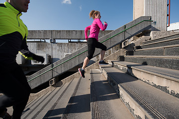 Image showing young  couple jogging on steps