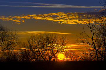 Image showing Landscape Dramatic sunset and sunrise sky with a silhouette of t