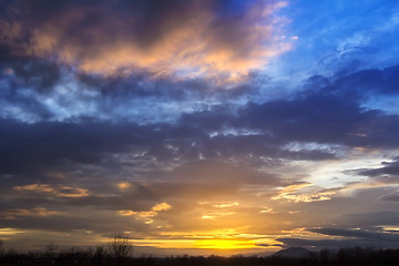 Image showing Landscape Dramatic sunset and sunrise sky with a silhouette of t
