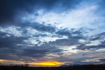 Image showing Landscape Dramatic sunset and sunrise sky with a silhouette of t