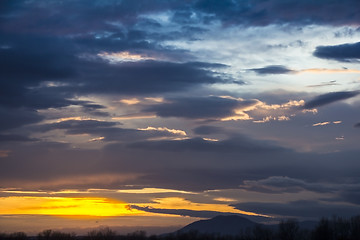 Image showing Landscape Dramatic sunset and sunrise sky with a silhouette of t