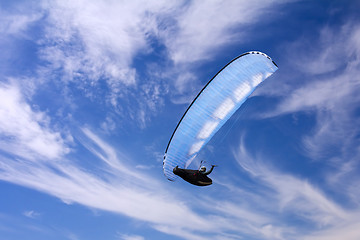 Image showing Paragliding on background of blue summer sky and white clouds