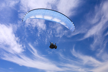 Image showing Paragliding on background of blue summer sky and white clouds