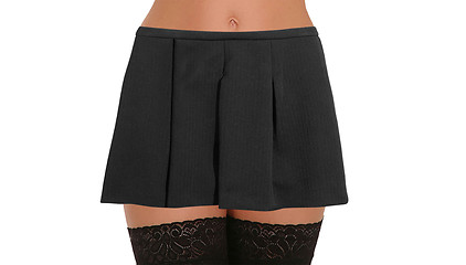 Image showing Woman legs with nylons wearing skirt