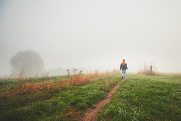 Image showing Lonely young man in mysterious fog