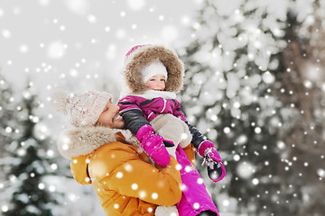 Image showing happy family in winter clothes outdoors