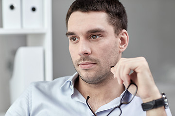 Image showing portrait of businessman with eyeglasses at office