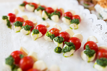 Image showing close up of mozzarella and cherry tomato canape