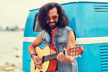 Image showing hippie man playing guitar over minivan car outdoor