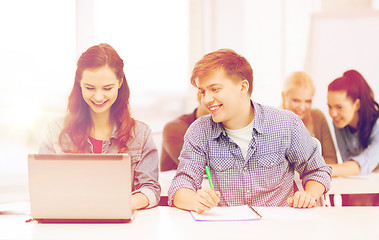 Image showing students with laptop and notebooks at school