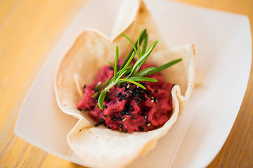 Image showing close up of dough cornet with beetroot filling