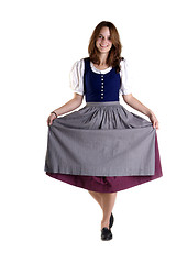 Image showing woman in Dirndl drops a curtsey