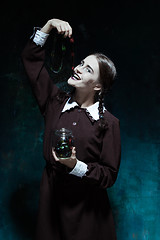 Image showing The Halloween theme: crazy girl with snakes