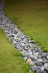 Image showing Stone and green grass