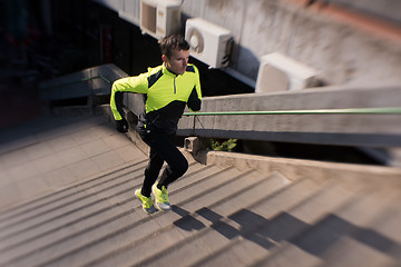 Image showing man jogging on steps