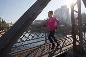 Image showing sporty woman jogging on morning