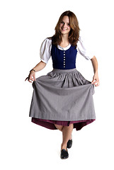 Image showing woman in Dirndl drops a curtsey