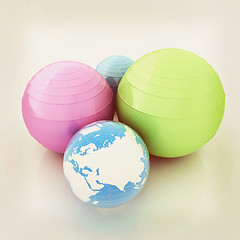 Image showing Pilates fitness ball and earth. 3D illustration. Vintage style.