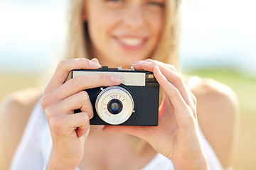 Image showing close up of woman photographing with film camera