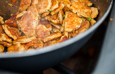 Image showing close up of meat in wok pan at street market