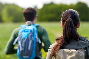 Image showing close up of couple with backpacks hiking outdoors