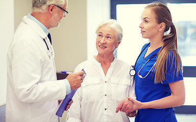Image showing medics and senior patient woman at hospital