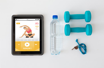 Image showing tablet pc, dumbbells, whistle and water bottle