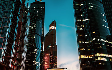 Image showing Skyscrapers With Glass Walls Against The Night Sky