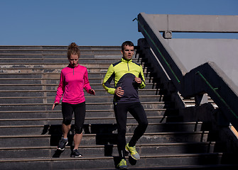 Image showing young  couple jogging on steps