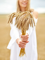 Image showing close up of happy woman with cereal spikelets