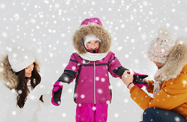 Image showing happy family with child in winter clothes outdoors