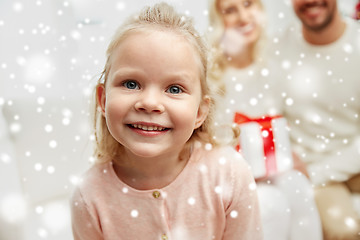 Image showing happy family at home with christmas gift box